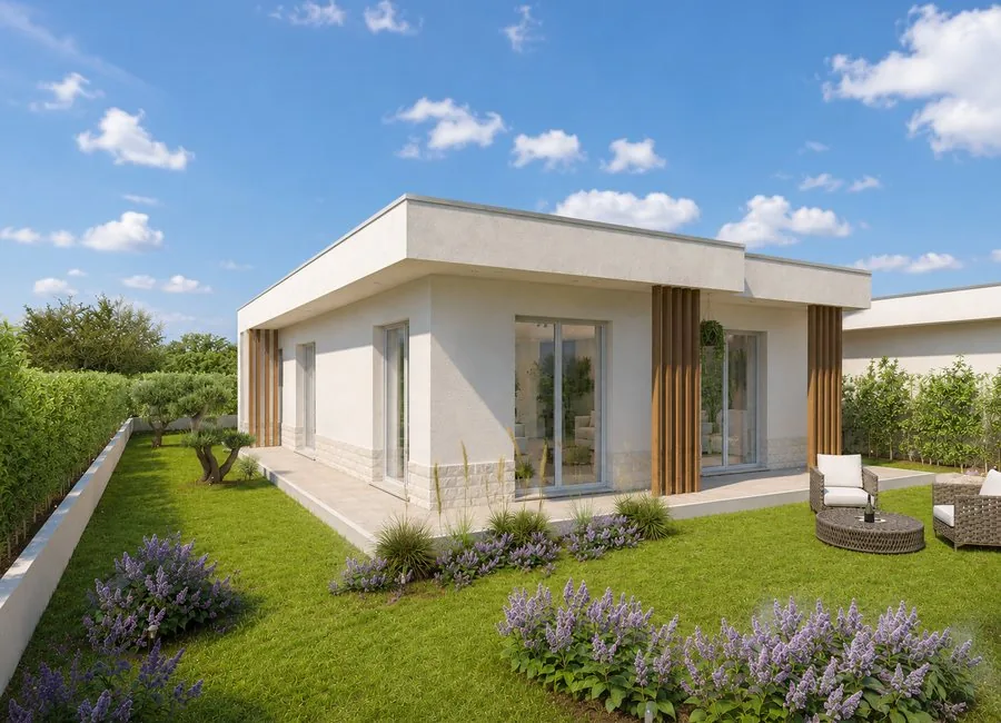 Vista frontale diurna della villa con giardino privato